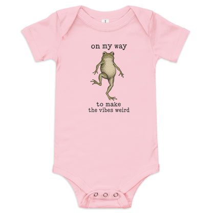 On My Way to Make the Vibes Weird Baby Onesie in Pink, front