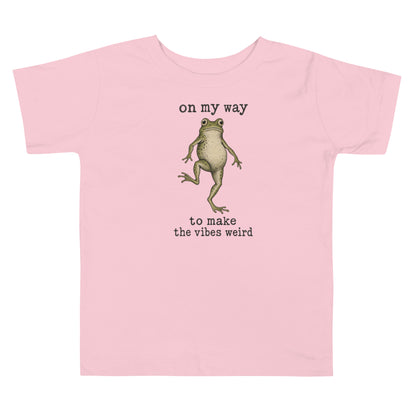 On My Way to Make the Vibes Weird Toddler T-Shirt in Pink, front