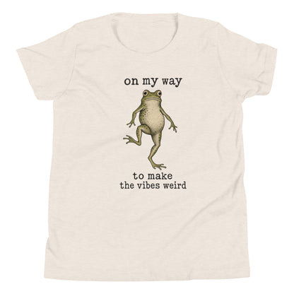 On My Way to Make the Vibes Weird Youth T-Shirt in Heather Dust, front